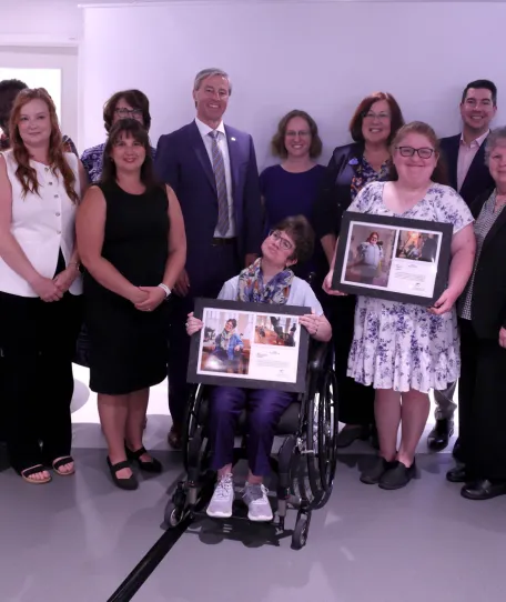 Group of representatives of the HomeShare co-ordinating organizations and campaign participants gather following the announcement.